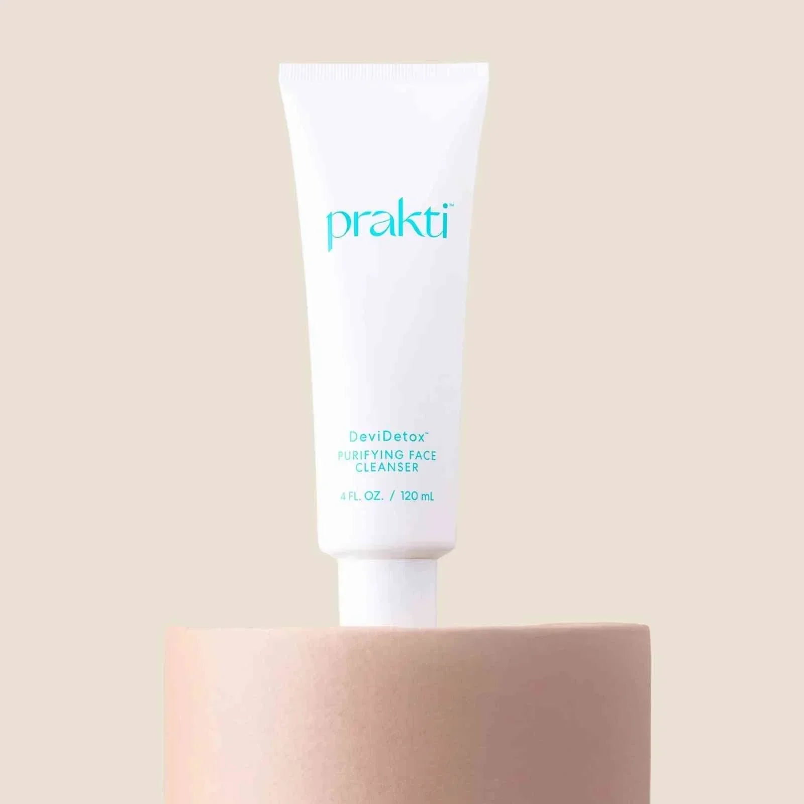 DeviDetox hydrating cleanser tube by Prakti on beige pedestal for clear radiant skin