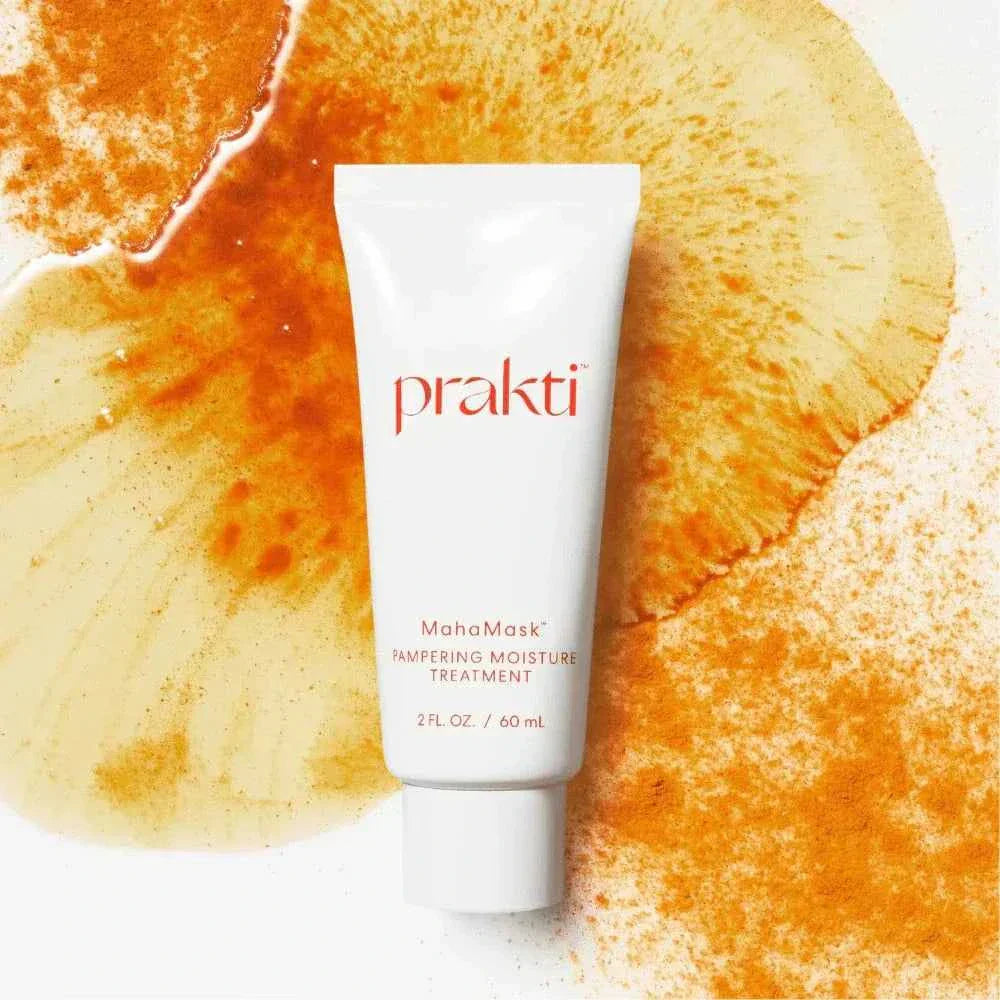 White tube of MahaMask moisturizing mask by Prakti on orange and yellow textured background