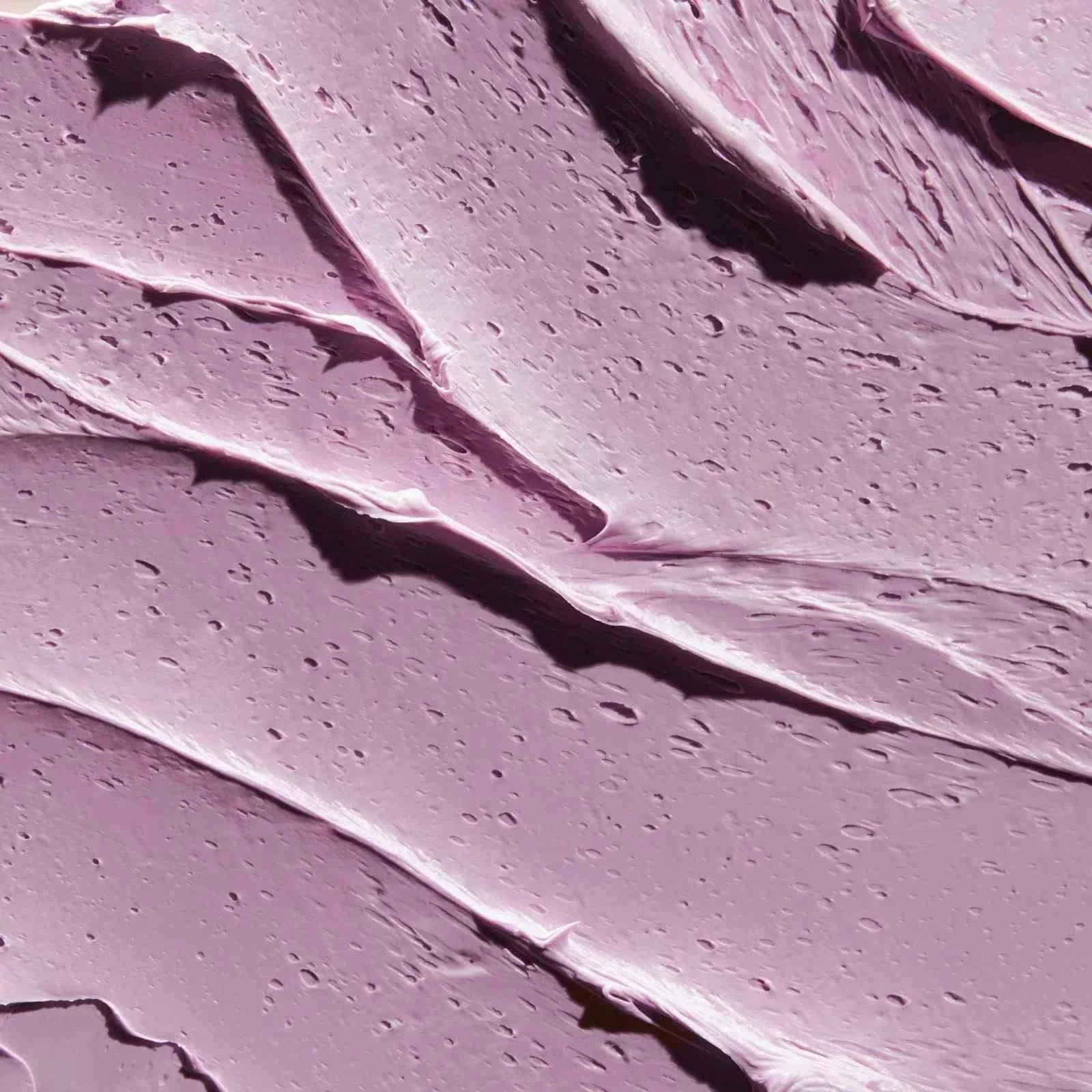 Close-up of creamy purple PaviPure detox clay mask texture smoothing skin pores