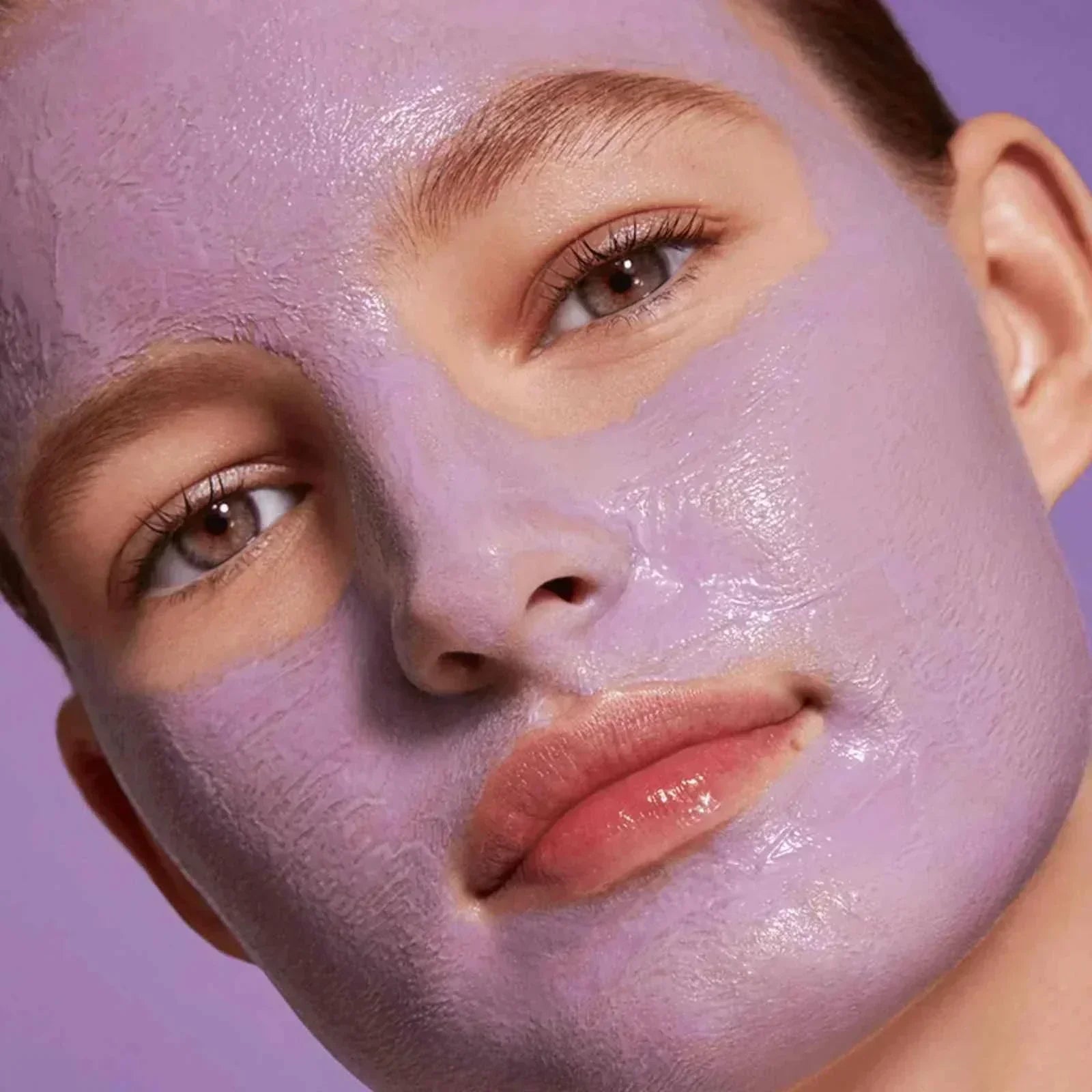 woman with purple hydrating face mask from BindaasBeauty skincare set