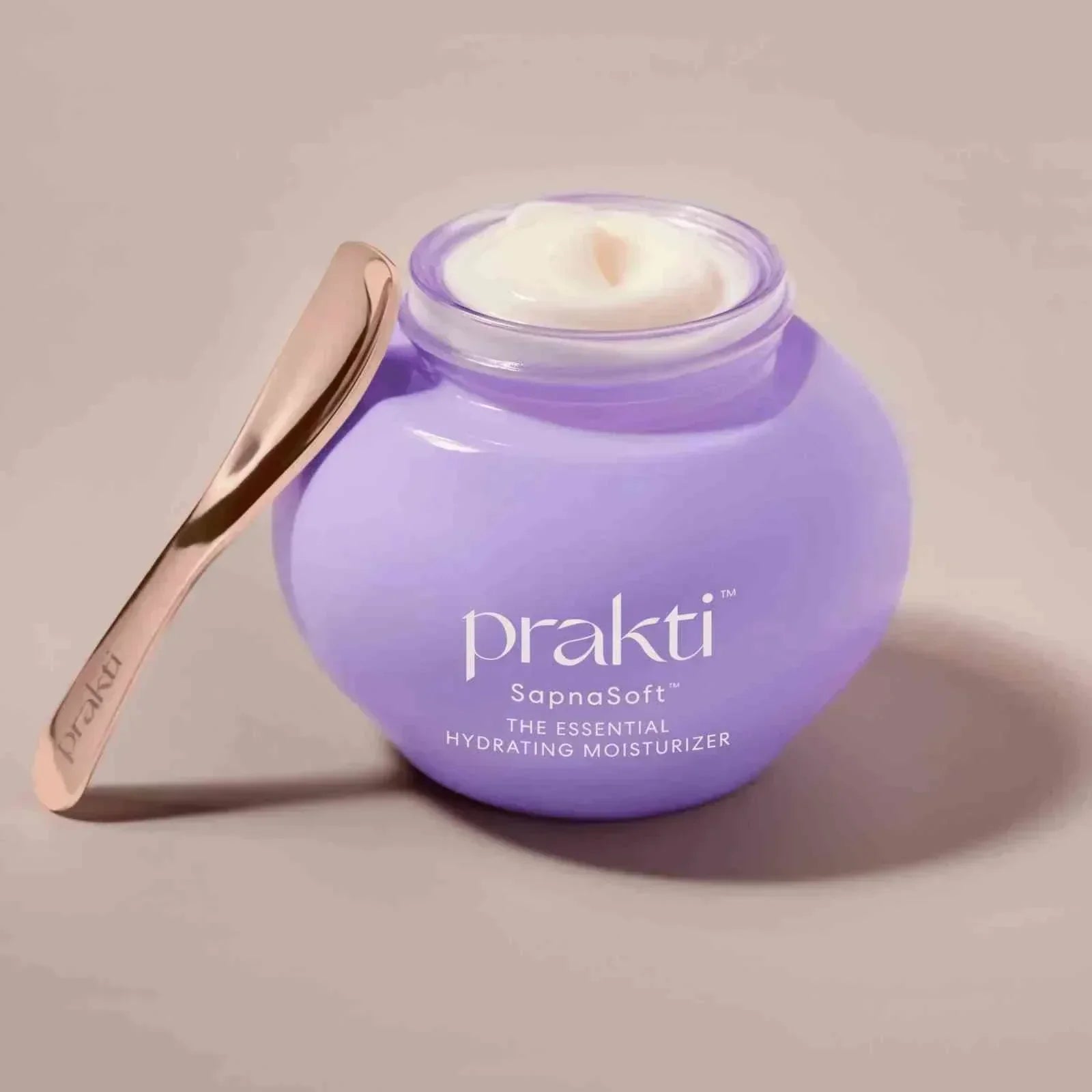 SapnaSoft weightless moisturizer in purple jar with applicator spoon for deep hydration and skin smoothing